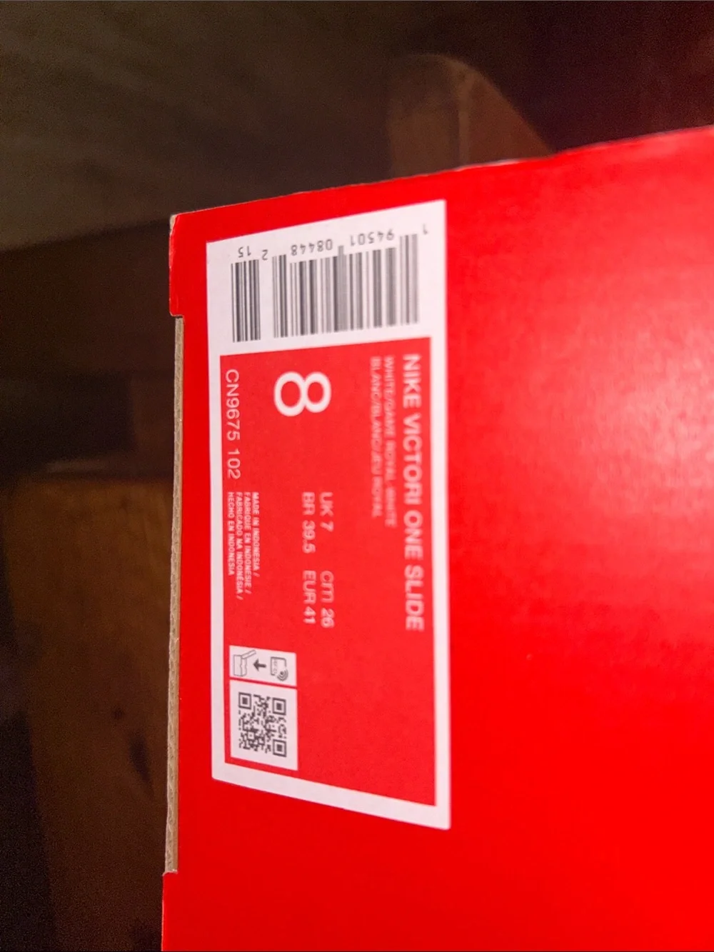 Nike White Slide Sandals with Blue Logo